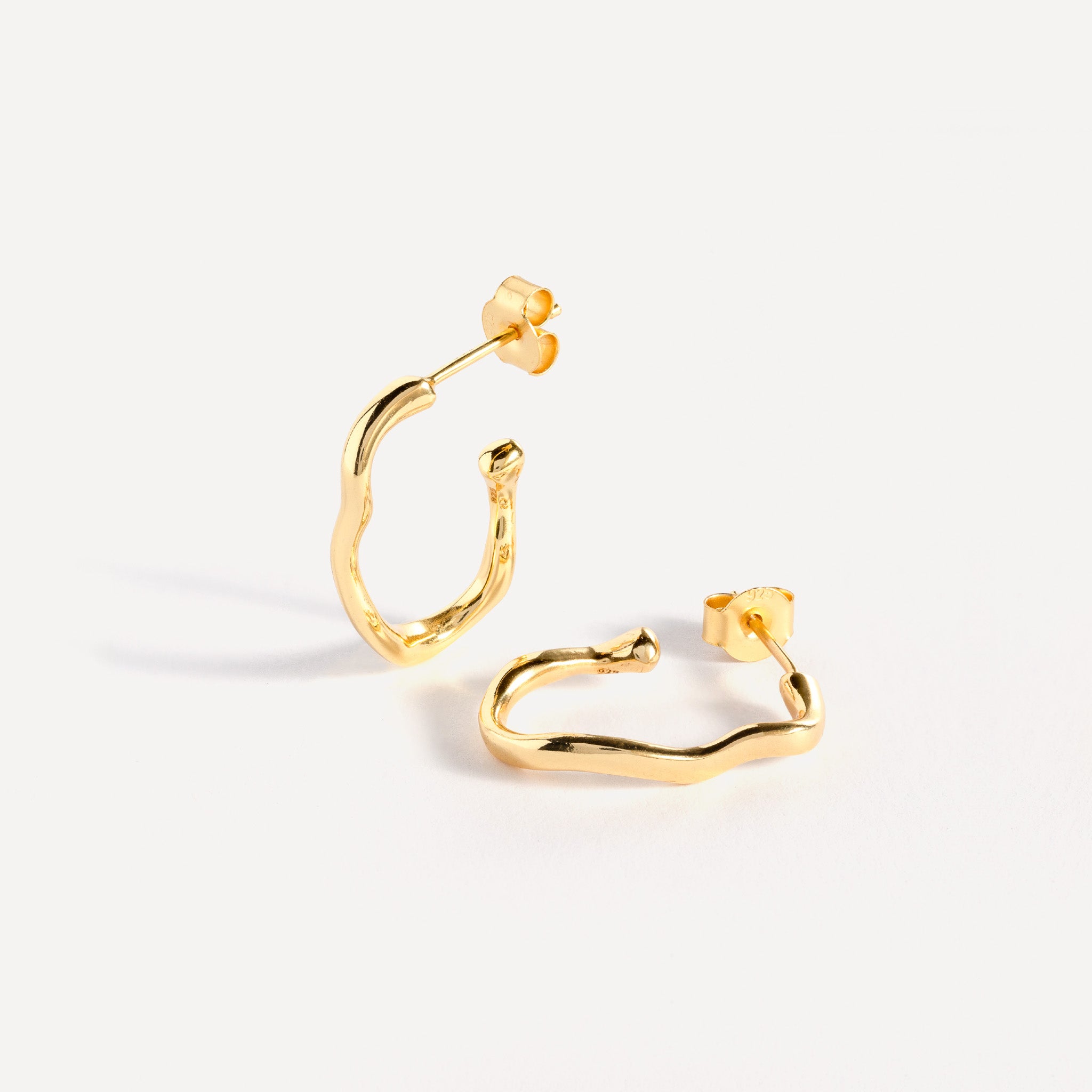 Earring features a handcut natural ripple shape and is crafted from sterling silver or 18ct gold vermeil.