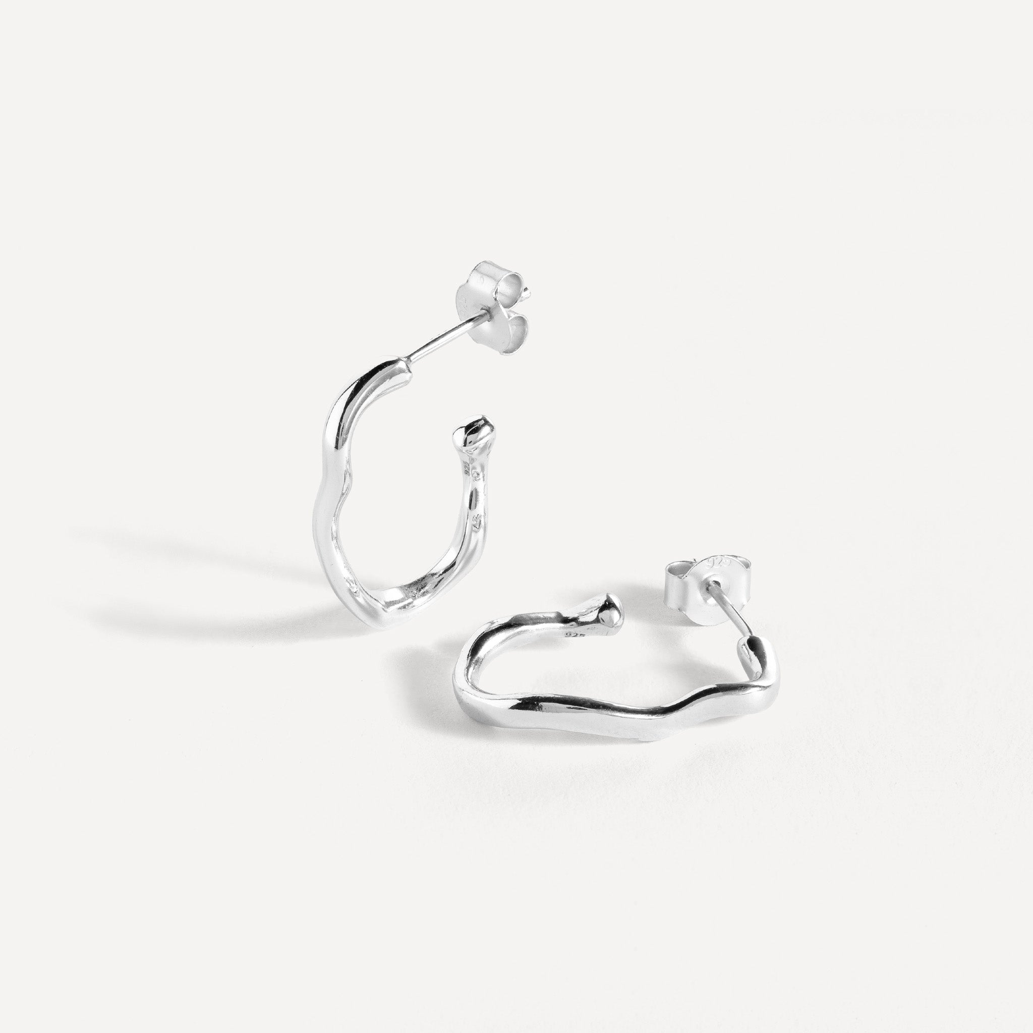 Earring features a handcut natural ripple shape and is crafted from sterling silver or 18ct gold vermeil.