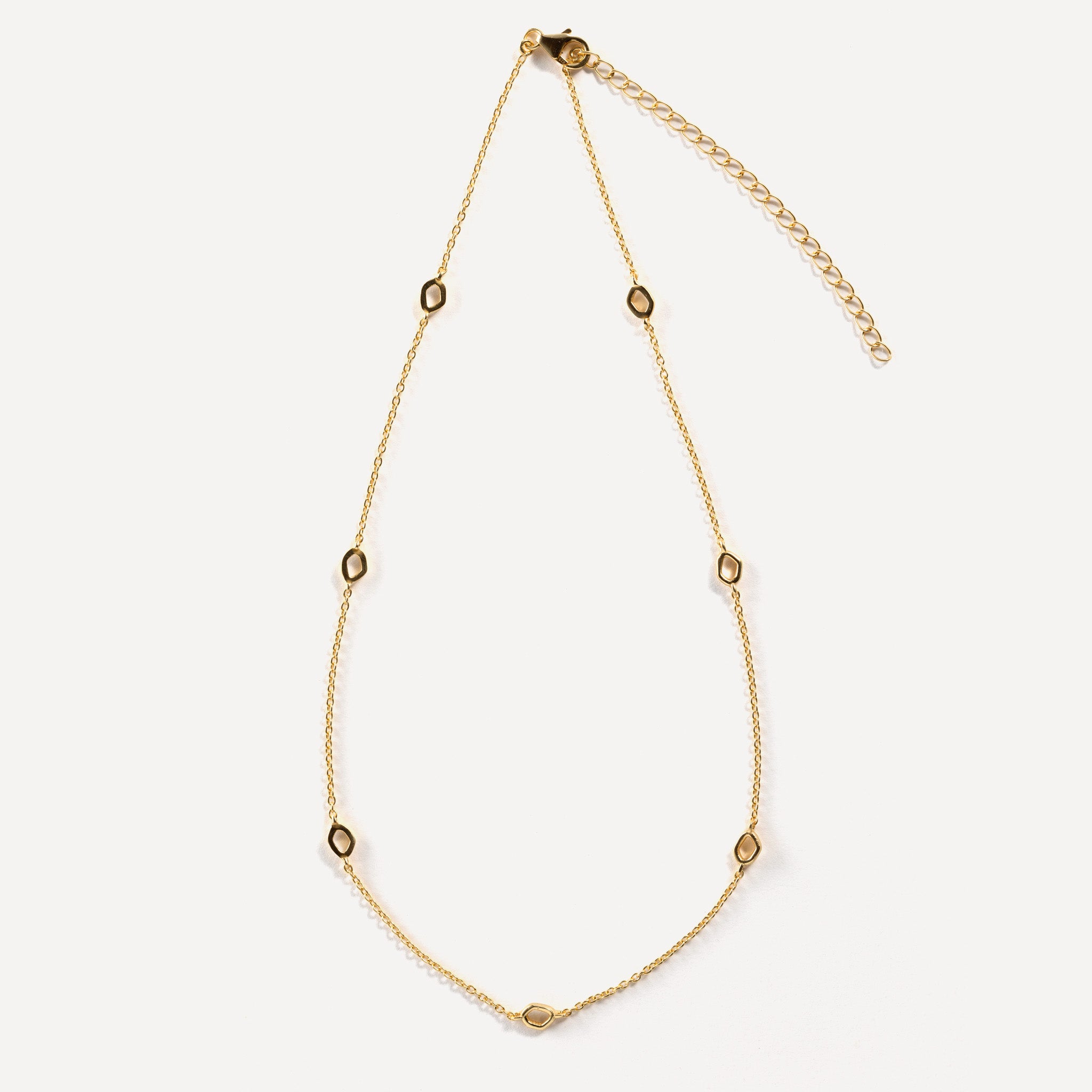 Dapple necklace is inspired by gentle evening sunlight filtering through the trees and are crafted in sterling silver and 18ct gold vermeil