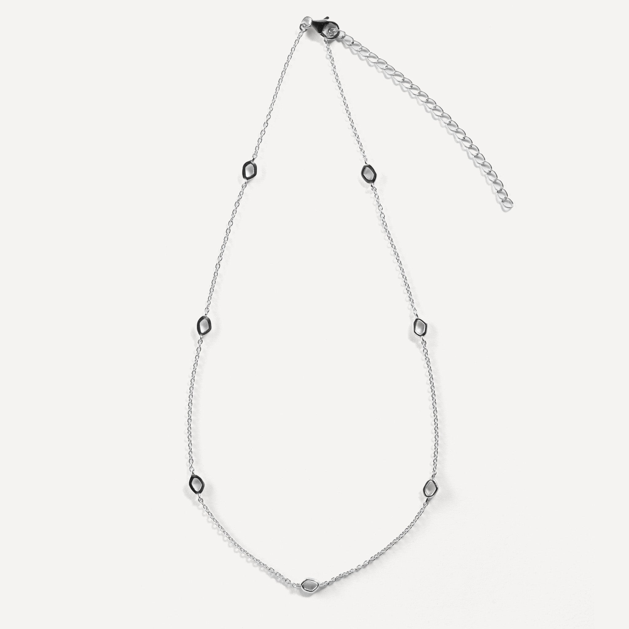 Dapple necklace is inspired by gentle evening sunlight filtering through the trees and are crafted in sterling silver and 18ct gold vermeil
