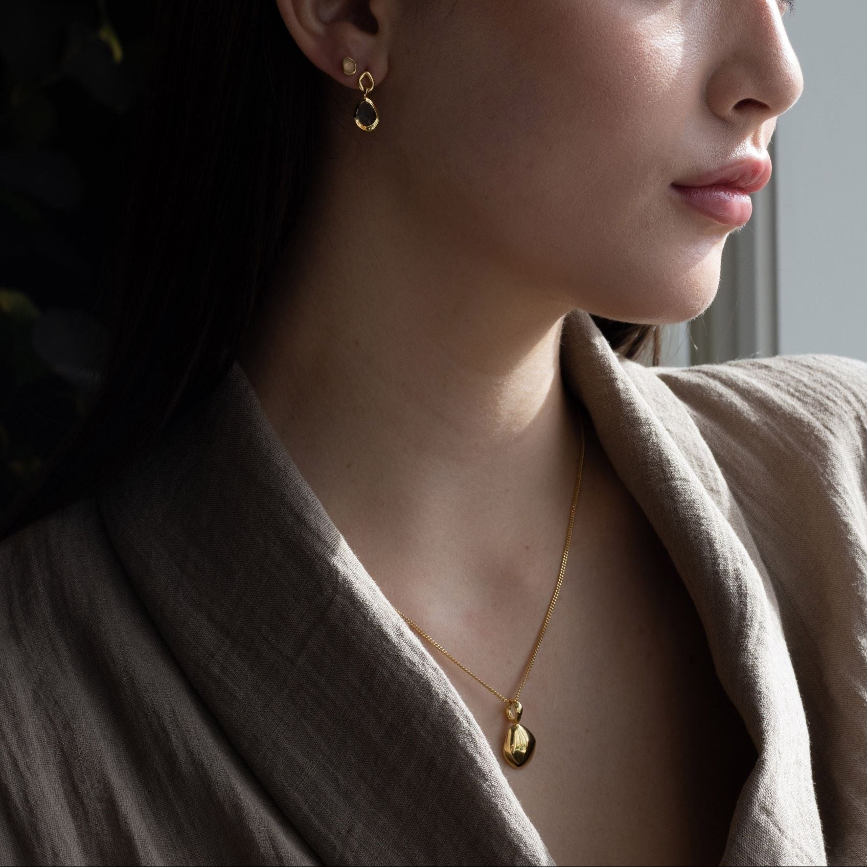 Charm features a handcut natural pebble shape and is crafted from sterling silver or 18ct gold vermeil.
