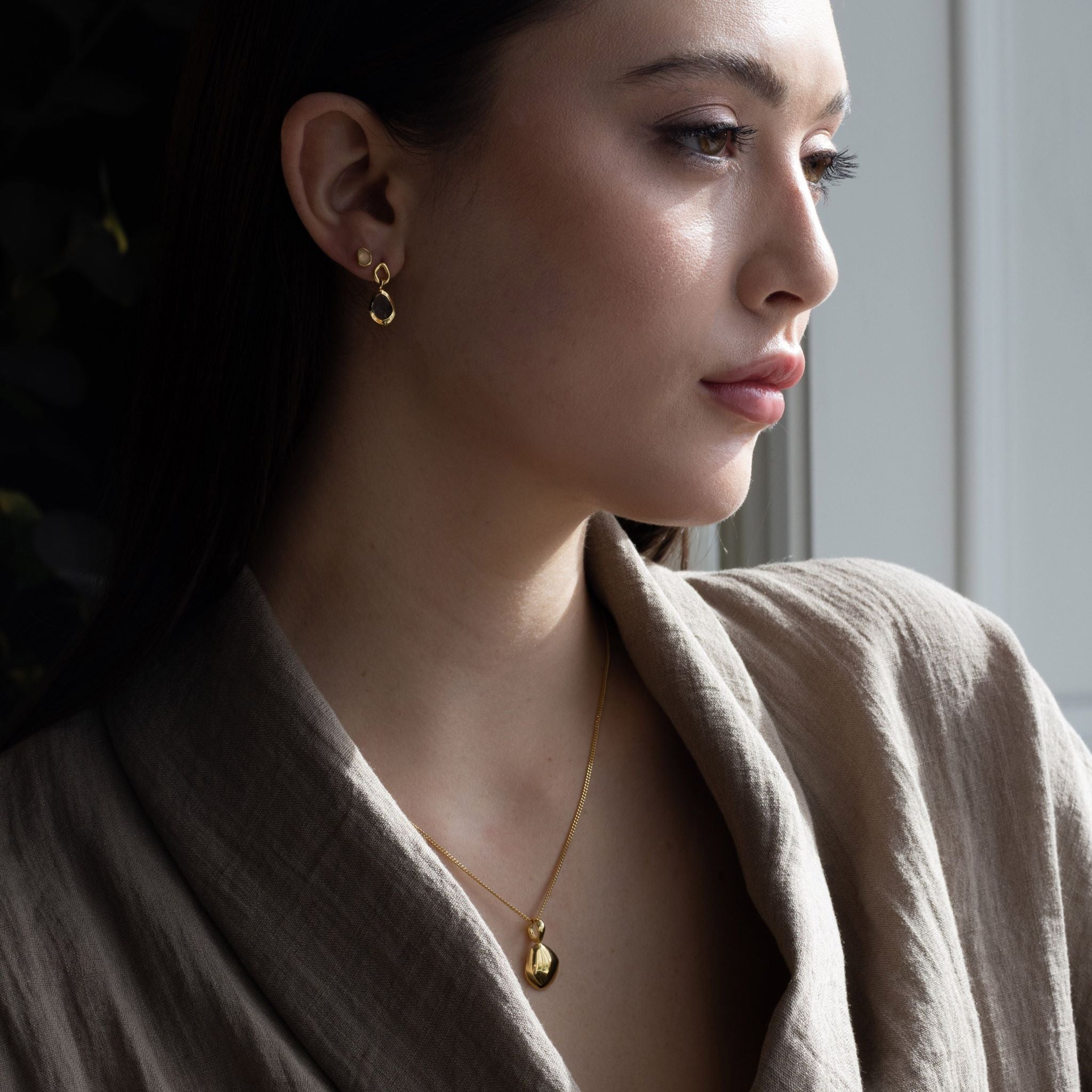 Charm features a handcut natural pebble shape and is crafted from sterling silver or 18ct gold vermeil.