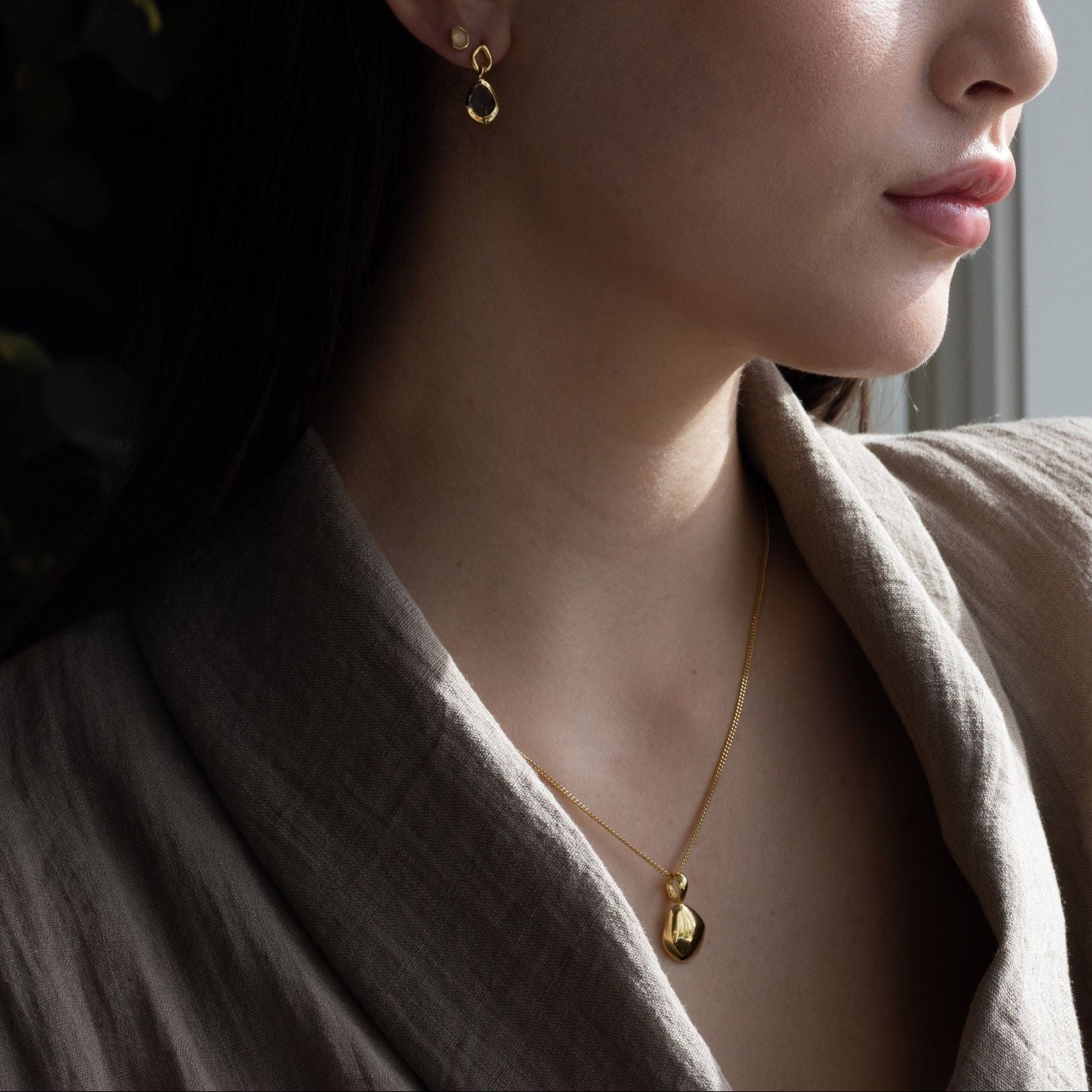 Pendant features a handcut natural pebble shape and is crafted from sterling silver or 18ct gold vermeil.