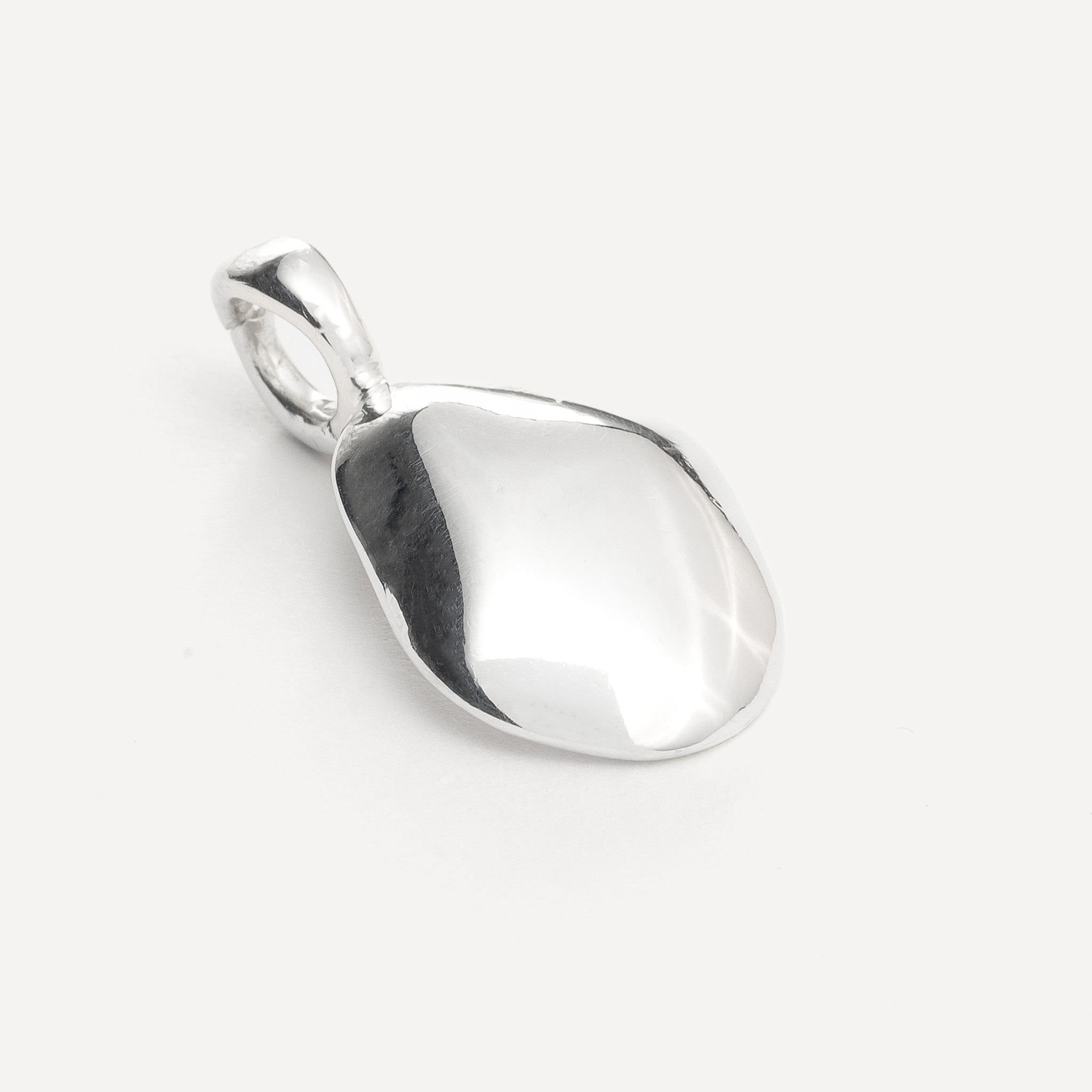 Charm features a handcut natural pebble shape and is crafted from sterling silver or 18ct gold vermeil.