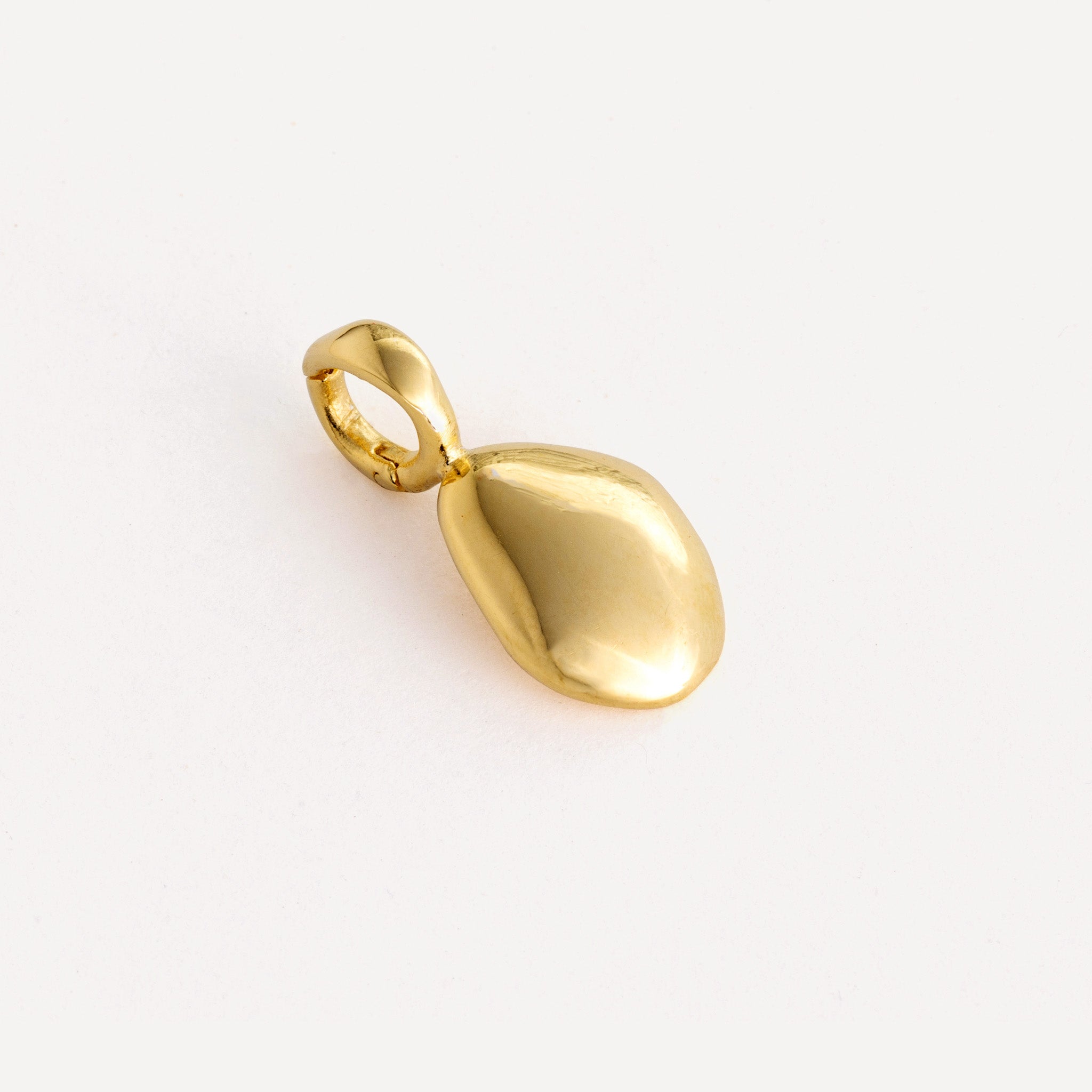 Charm features a handcut natural pebble shape and is crafted from sterling silver or 18ct gold vermeil.