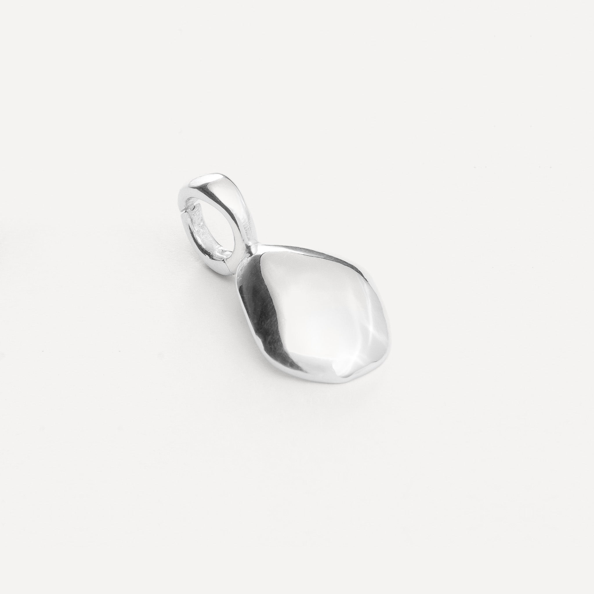 Charm features a handcut natural pebble shape and is crafted from sterling silver or 18ct gold vermeil.