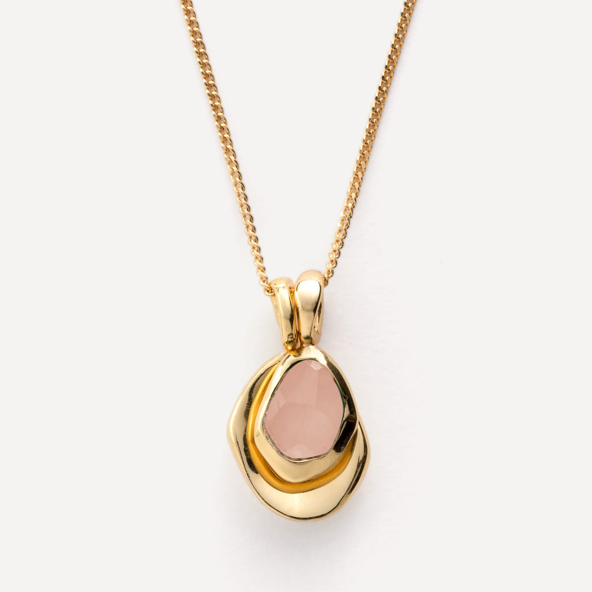 Pebble Charms necklace features a smooth, polished Pebble charm, nestled alongside a sparkling handcut Gemstone charm.