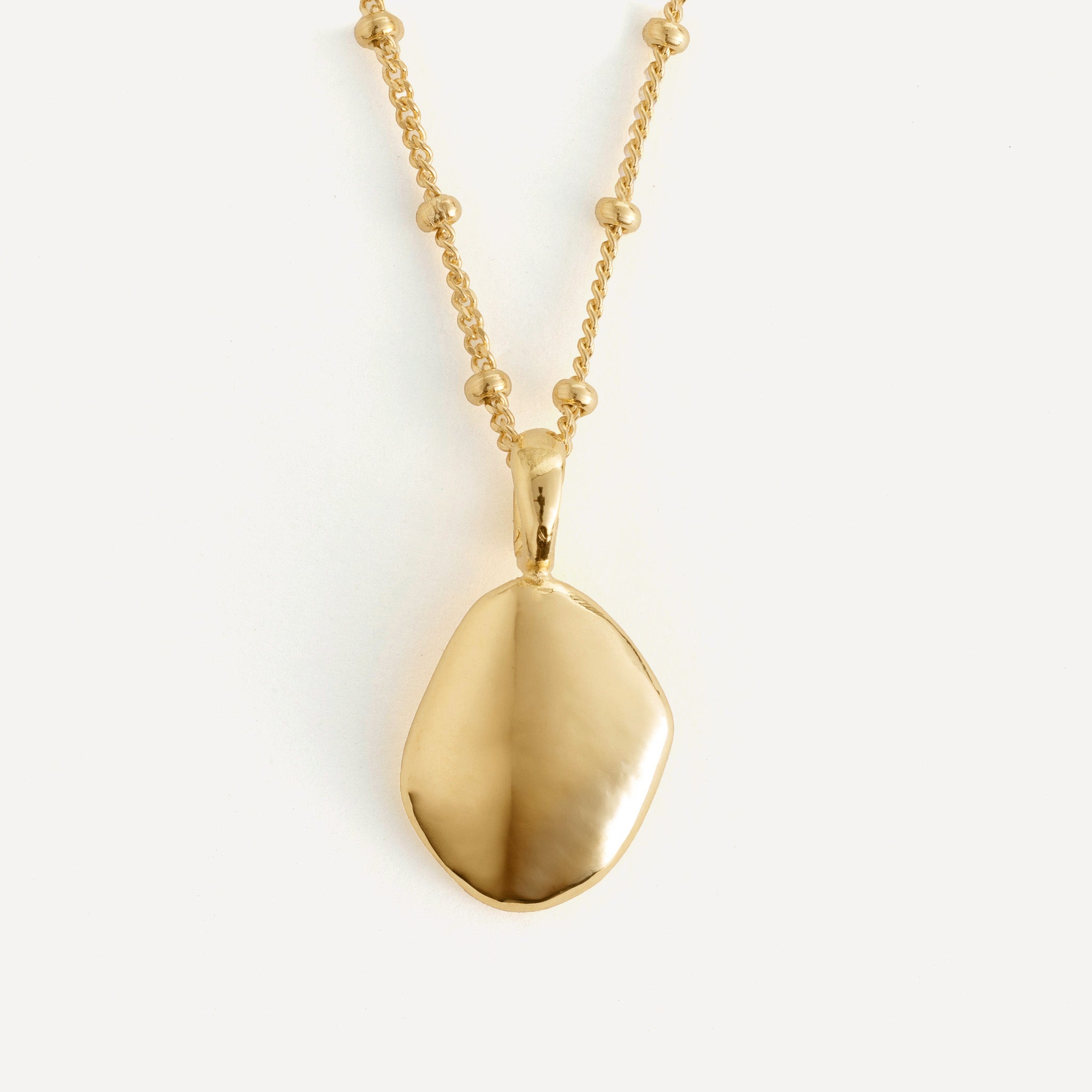 Pendant features a handcut natural pebble shape and is crafted from sterling silver or 18ct gold vermeil.