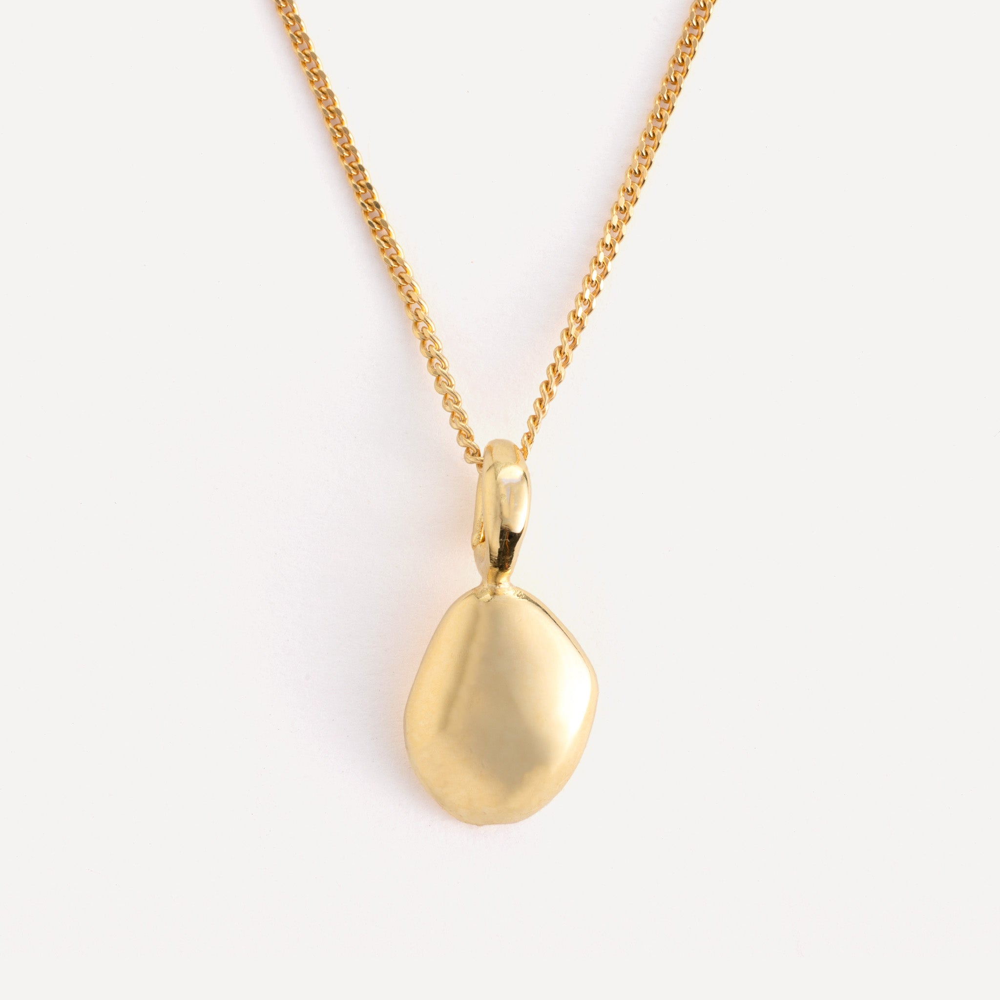 Pendant features a handcut natural pebble shape and is crafted from sterling silver or 18ct gold vermeil.