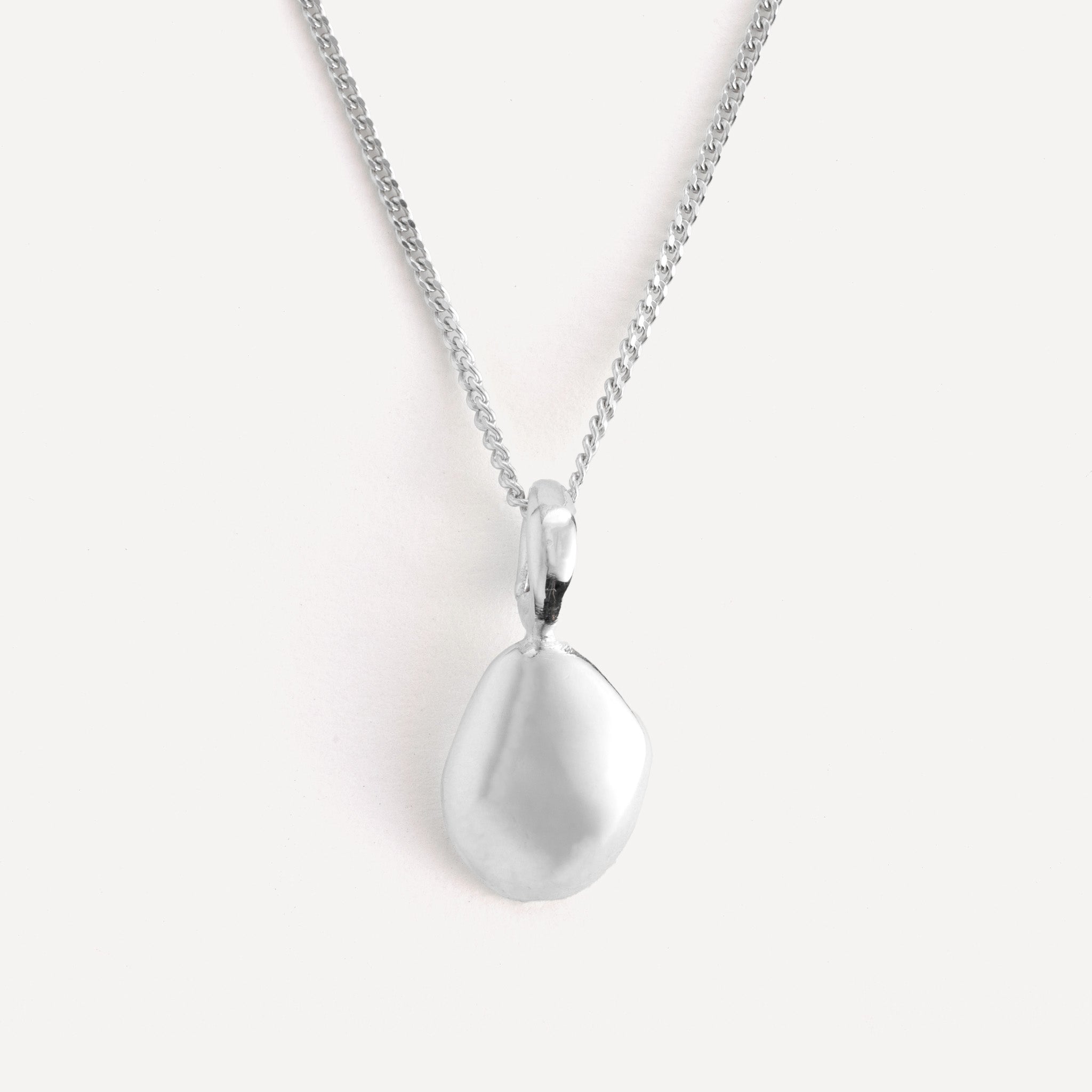Pendant features a handcut natural pebble shape and is crafted from sterling silver or 18ct gold vermeil.