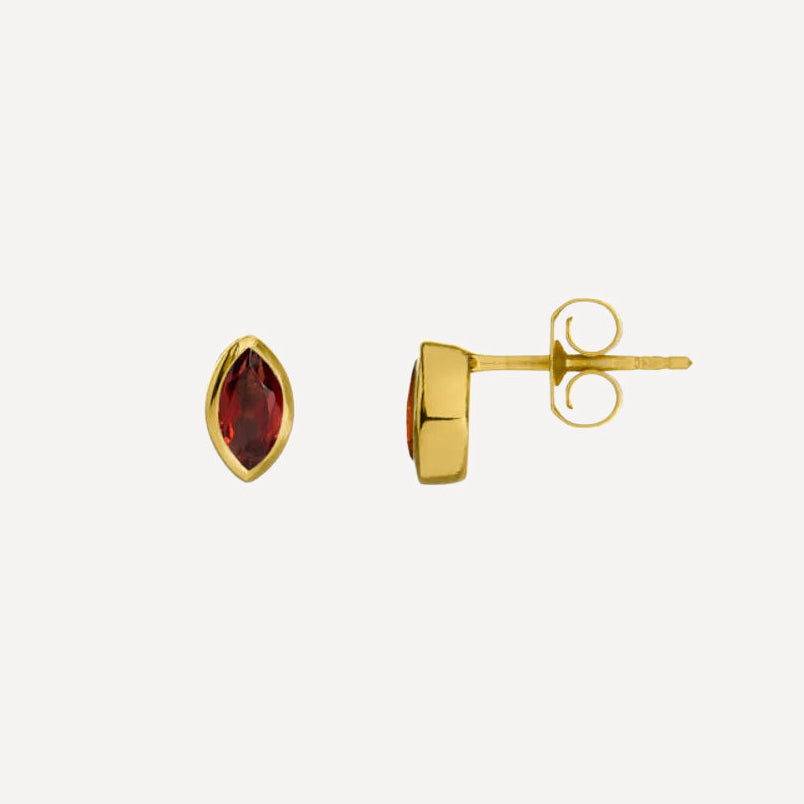 Gold earrings with gemstones on a white background