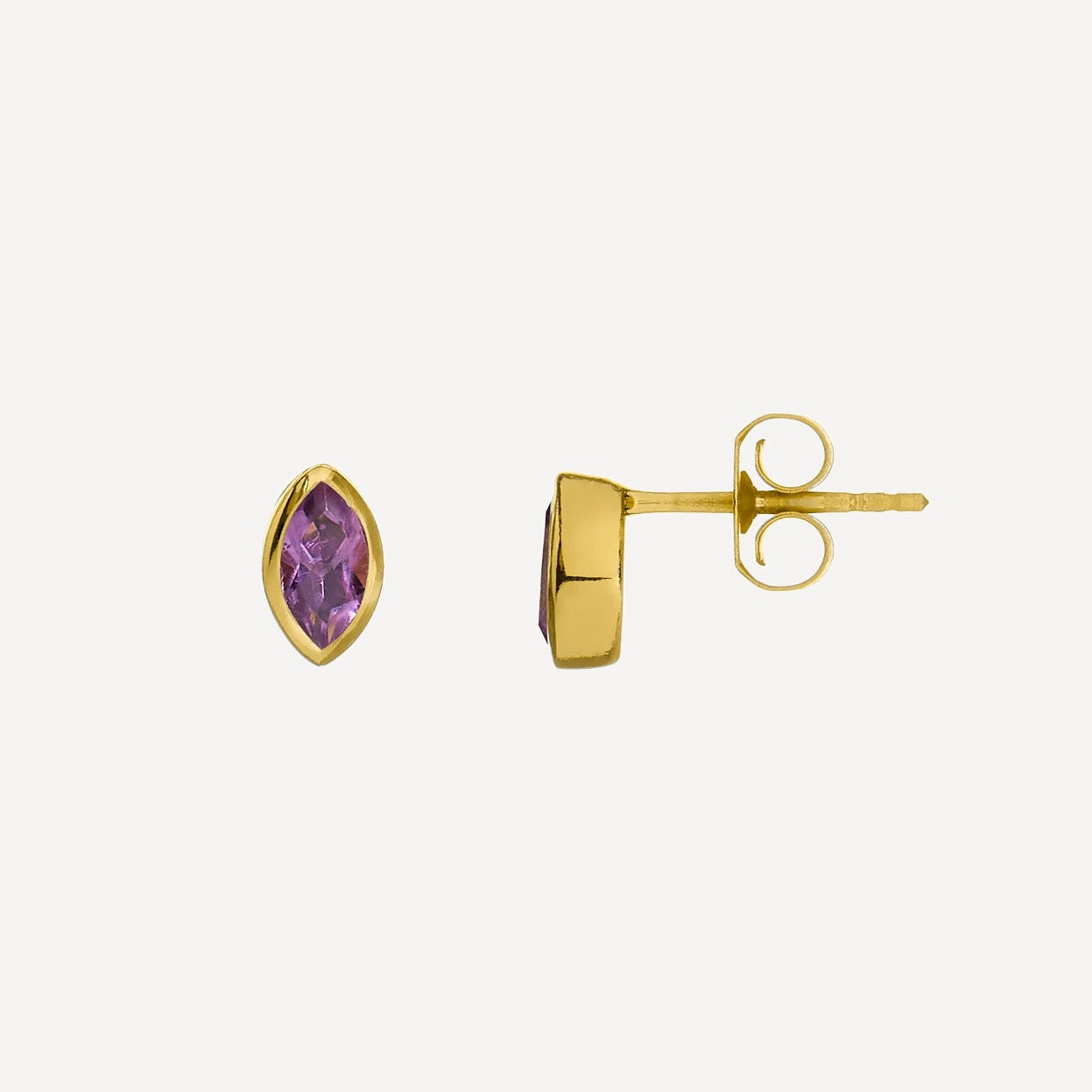 Gold earrings with purple gemstones on a white background